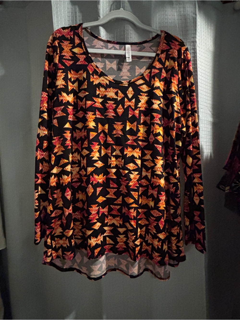 LuLaRoe Black Long Sleeve Top with Orange and Red Geometric Print